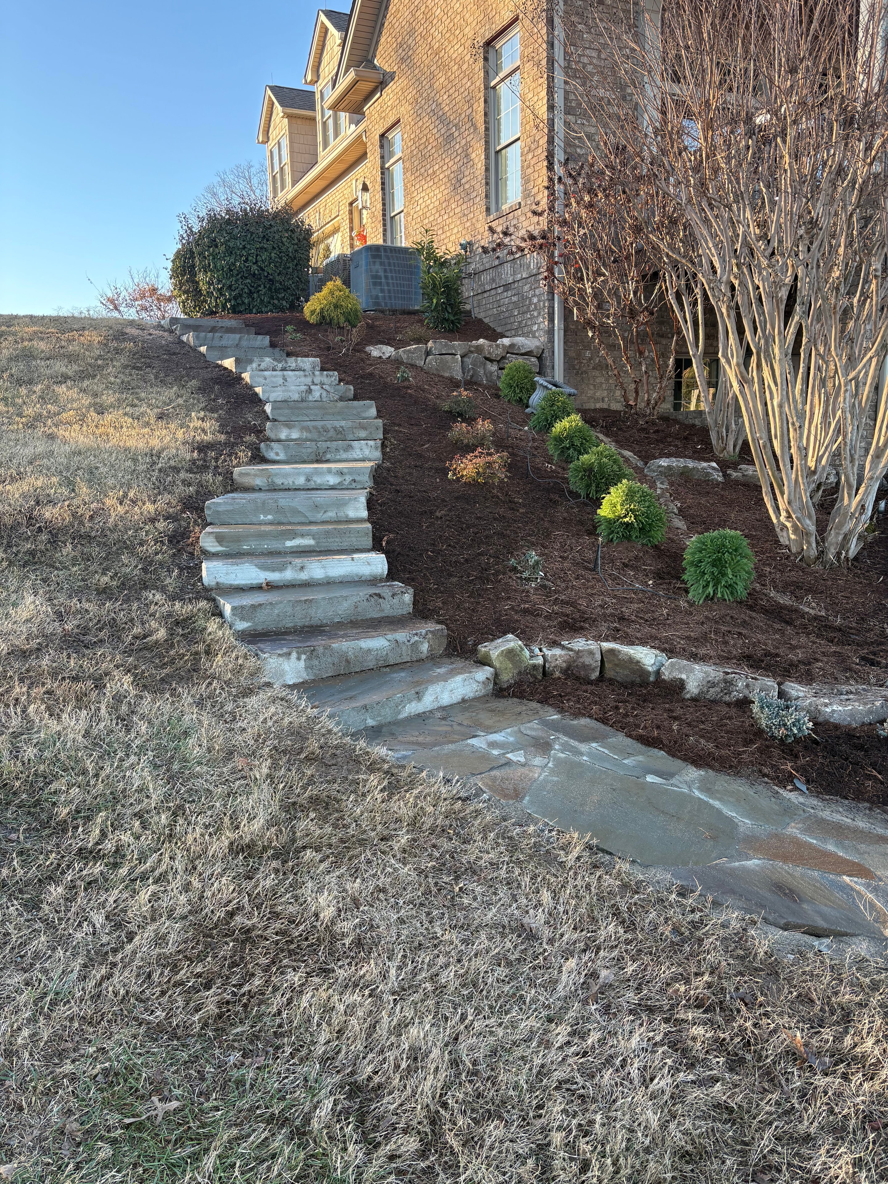 Natural stone steps with garden beds