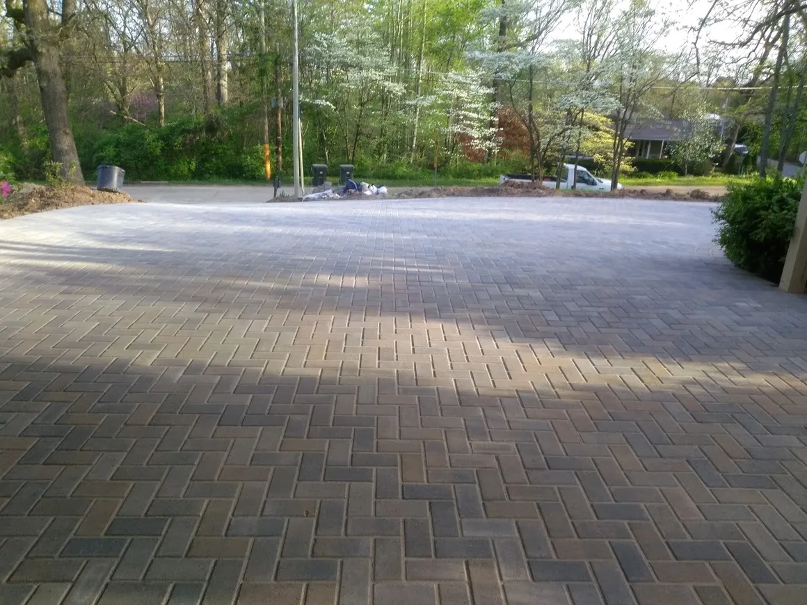 Large herringbone brick paver courtyard