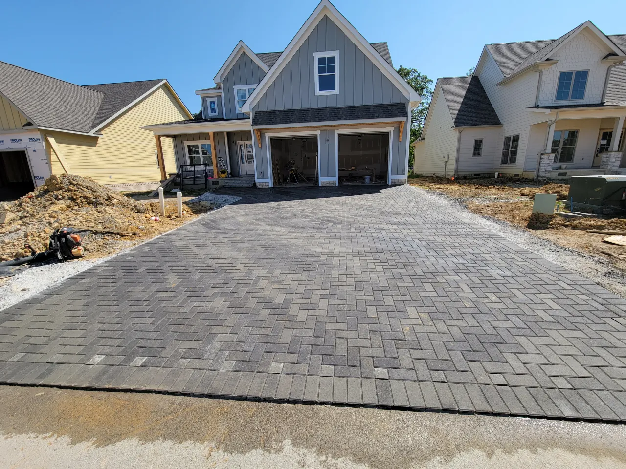 New paver driveway at modern farmhouse construction