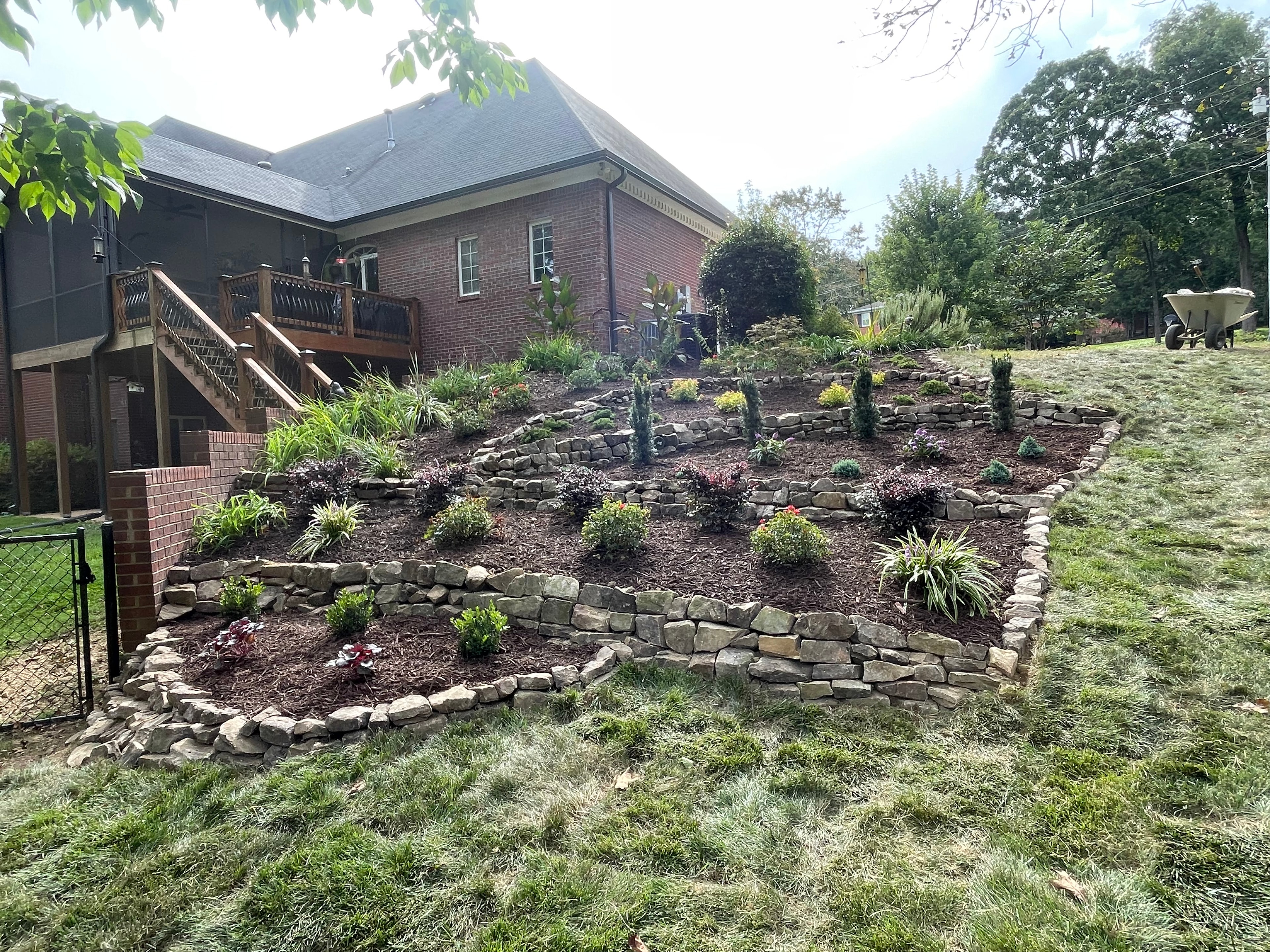 Terraced stone garden beds with plantings